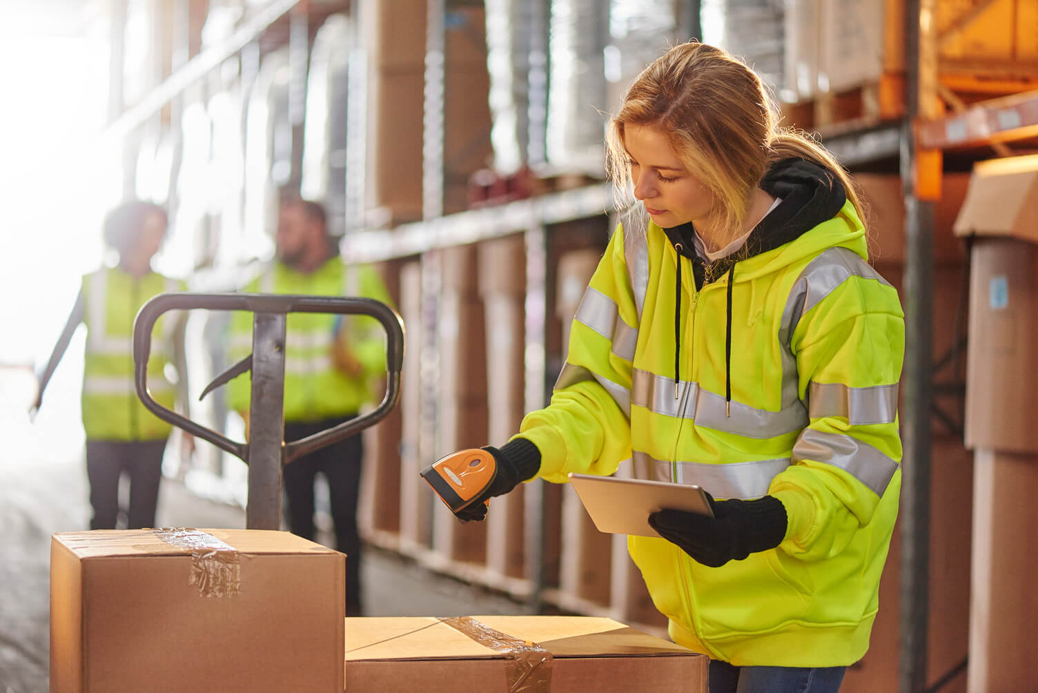 A female supply chain worker in a warehouse.